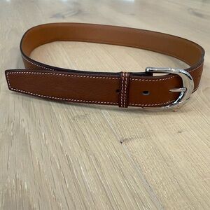 Hermès men’s leather belt with a classic curved palladium buckle